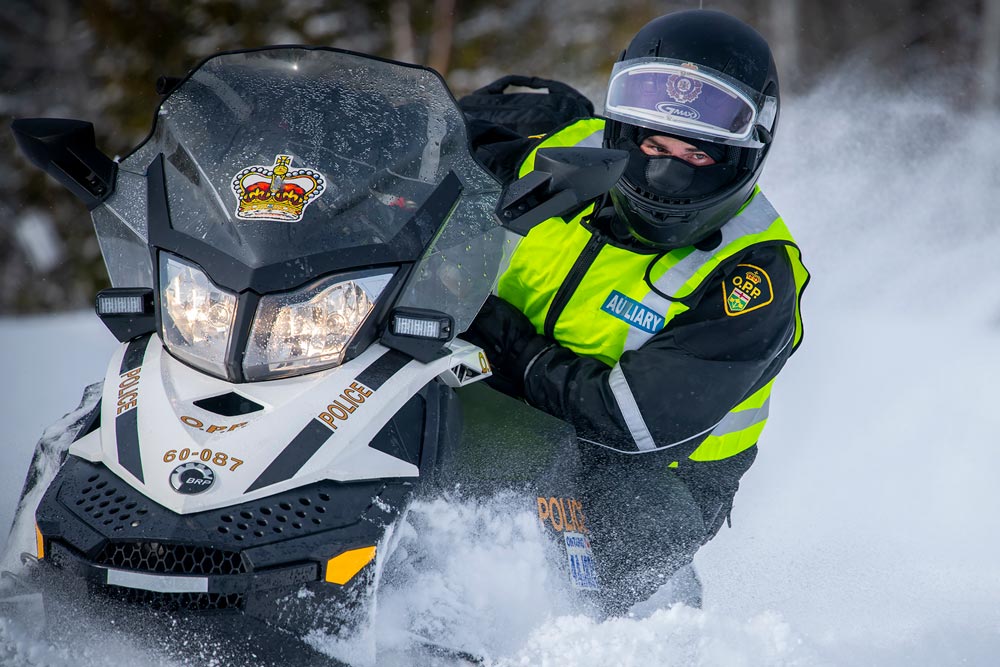 Auxiliary offier on Snow Vehicle