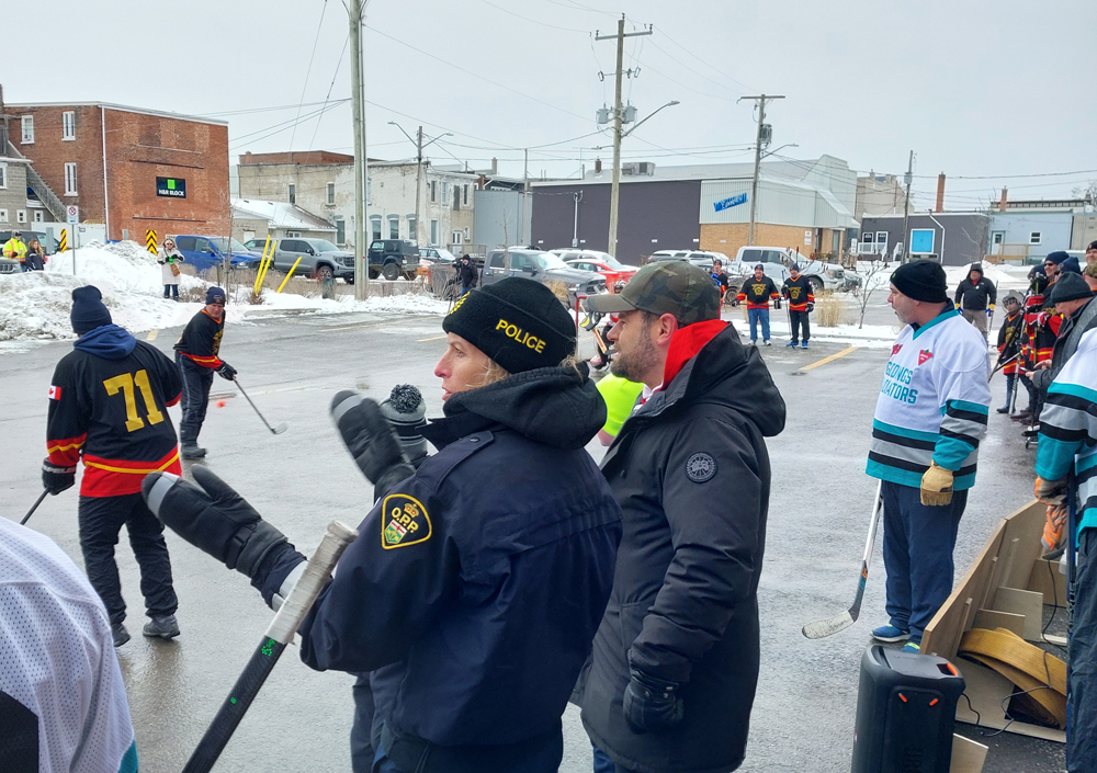 Northumberland OPP Detachment Commander refereed a charity hockey game between Fire Department and hospital staff