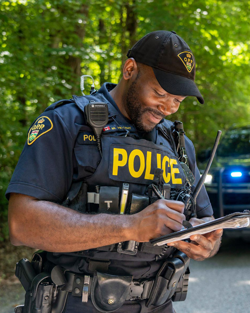 Officer writing in notebook