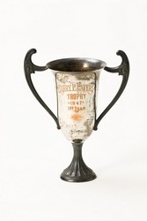 While it is no longer known what this Harry P. Cavers silver cup was the First Team prize for, Cavers himself was known for his service and fairness as a judge and later, as a Member of Parliament for Lincoln after he was elected in 1949, serving until 1957.