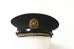 Peak cap worn by William Holebrook Stringer, O.B.E. in his role as Commissioner from 1939-1953.