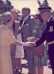 Commissioner Graham presented to H.M. Queen Elizabeth II by Premier William Davis at Upper Canada Village, near Morrisburg, Ontario, July 21, 1976. (2002.8.66)